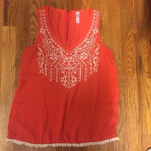 Pink tank top with white embroidery